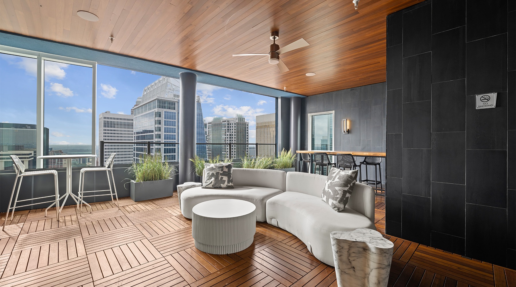 Resident Sky Lounge a lounge with a with of the city