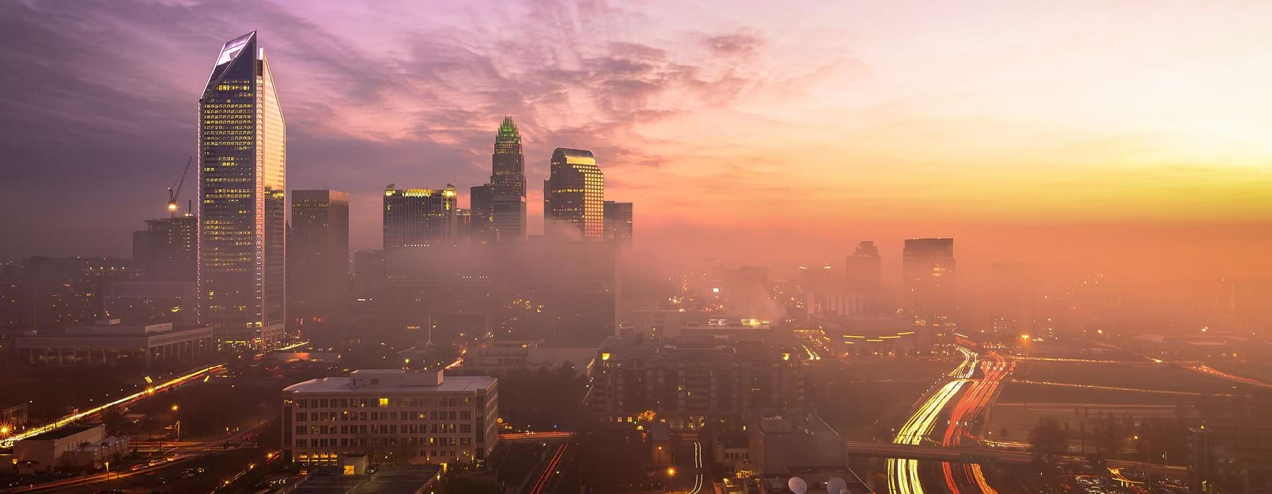 cityscape at dusk as fog rolls in